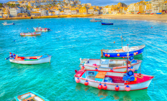 St Ives Cornwall colourful boats in harbour bright blue sea