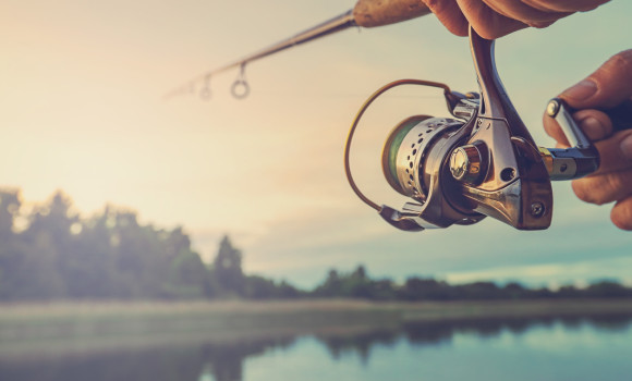 Fishing on the lake at sunset. Fishing background.