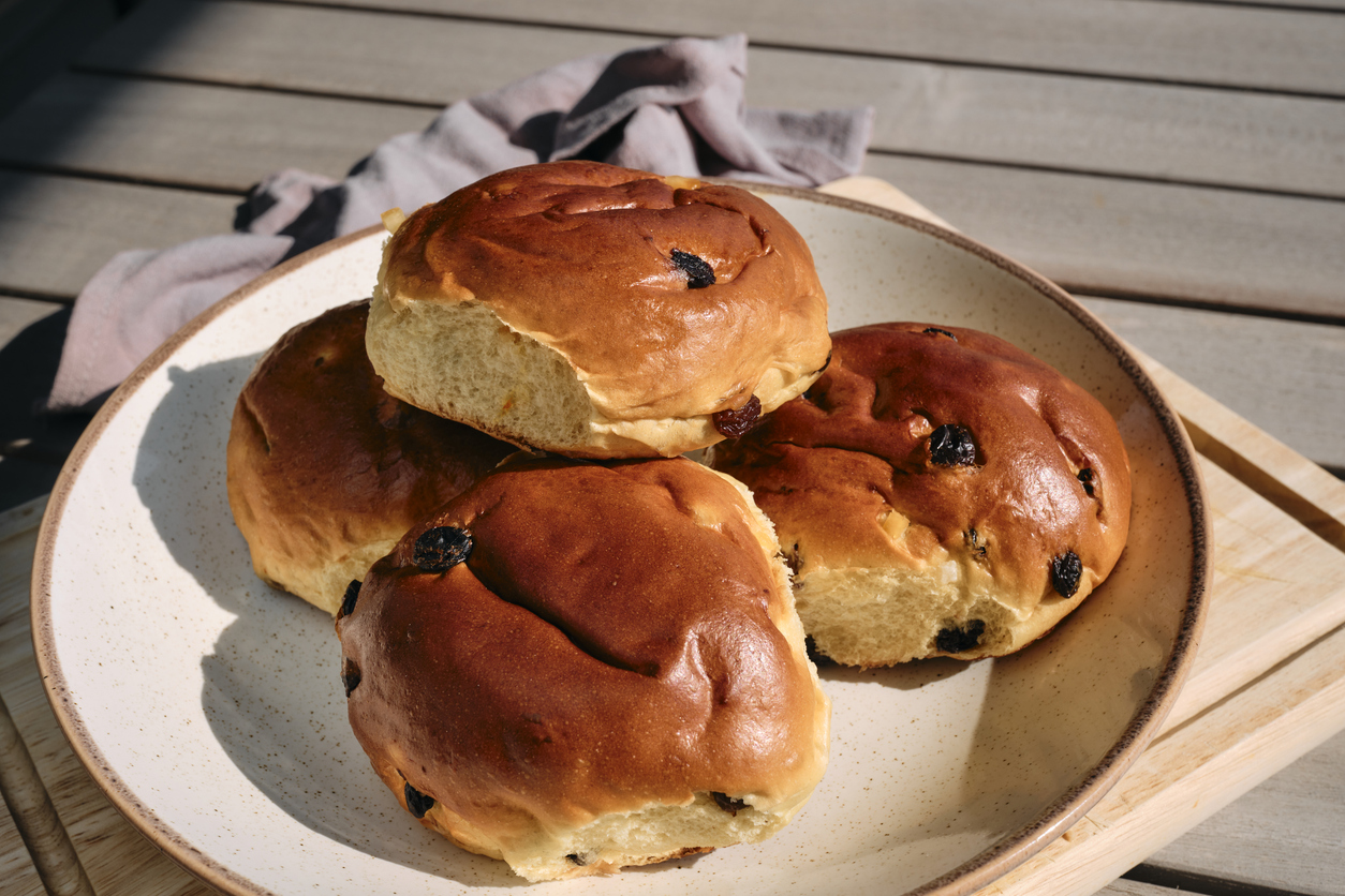 Plate of Traditional Cornish Saffron buns, photographed outdoors in Cornwall.