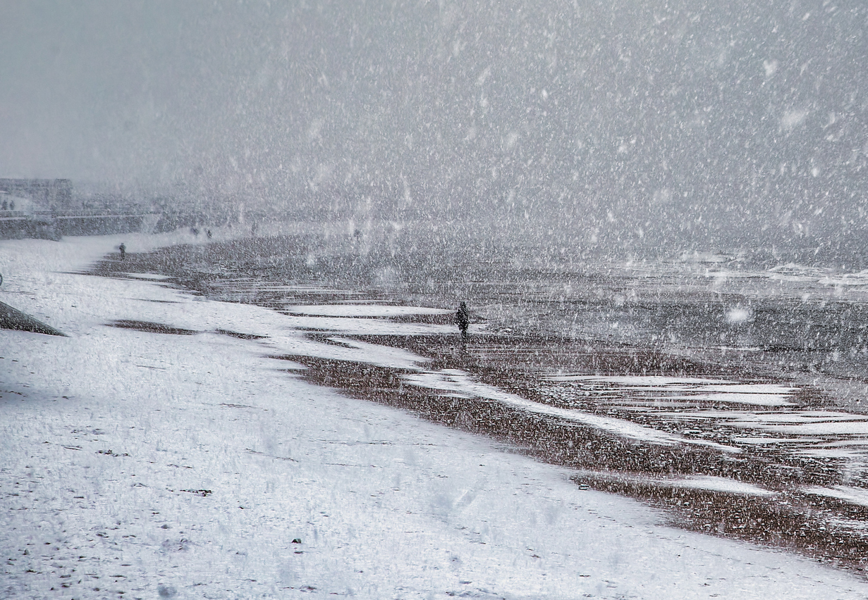Winter snow storm along the beach in England