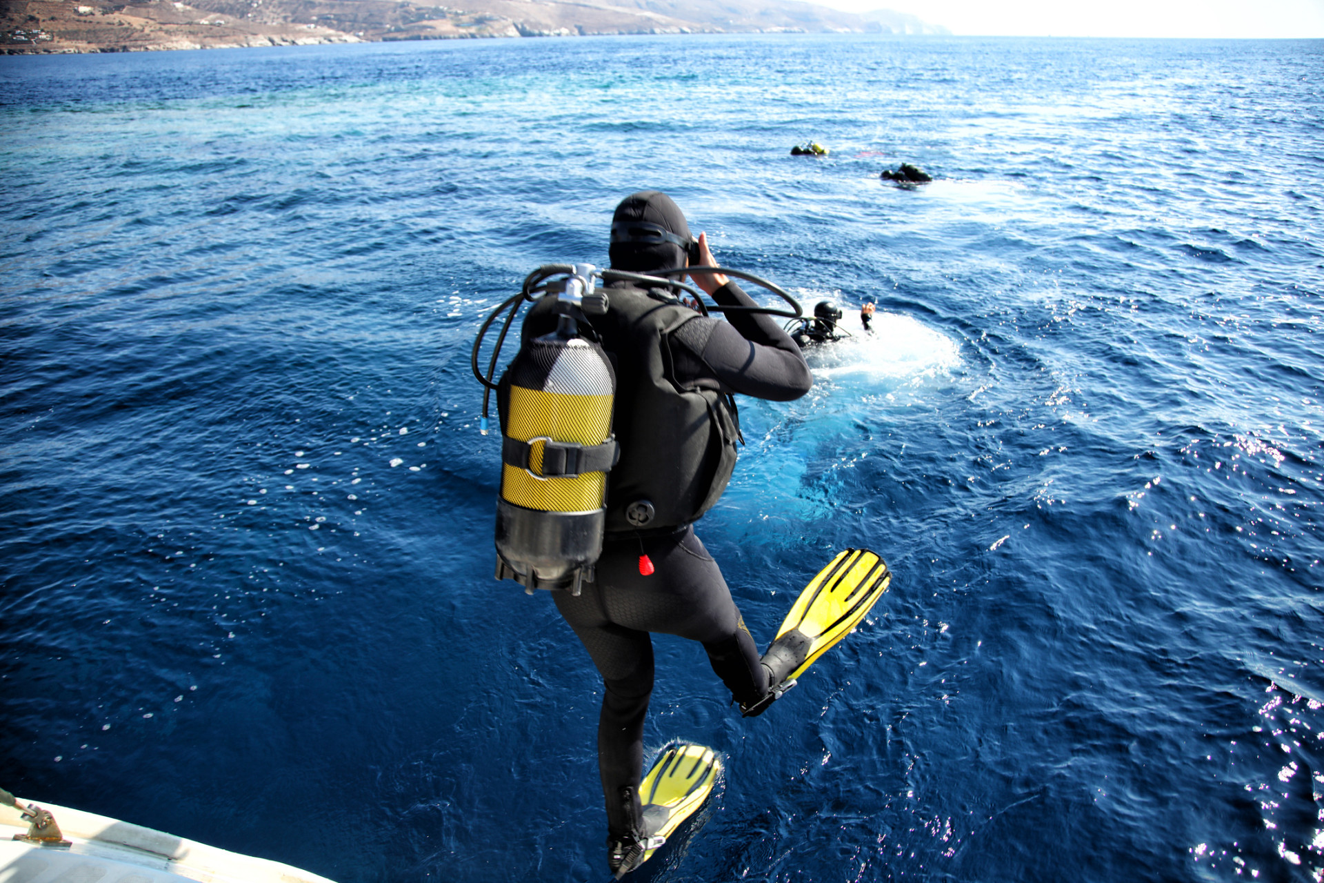 Divers jumping from the boat